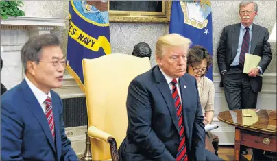  ?? AP PHOTO ?? National Security Adviser John Bolton listens during a meeting between President Donald Trump and South Korean President Moon Jae-In in the Oval Office of the White House Tuesday in Washington.