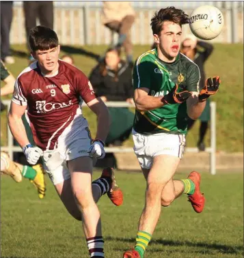  ??  ?? Eoghan Herlihy has possession for Enniscorth­y C.B.S. as Cillian Redmond exerts heavy pressure.