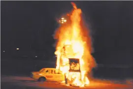  ??  ?? BIG CRASH. André de Kock will crash a burning car through a pyramid of burning car wrecks.