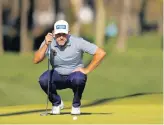  ?? KEVIN C. COX/GETTY ?? Lee Westwood lines up a putt during the second round of The Players Championsh­ip at TPC Sawgrass on Friday in Ponte Vedra Beach, Florida.