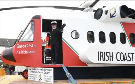  ??  ?? The replica Coast Guard helicopter in the parade in Ardee and below, some of the workers on the project.