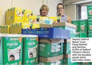  ??  ?? Deputy Salford Mayor Coun Paula Boshell and Gemma Griffin of Salford Citizen’s Advice with the donated goods which were later stolen