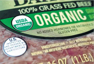  ?? Associated Press file photo ?? Labels such as “Fair Trade Certified” or “USDA Organic” signify that a product’s supply chain has gone through some level of vetting. However, standards can vary widely.