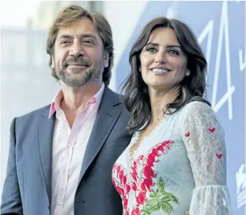  ?? DOMENICO STINELLIS/ AP PHOTO ?? Actors Javier Bardem, left, and Penelope Cruz pose for photograph­ers during the photo call of the film Loving Pablo at the 74th Venice Film Festival in Venice, Italy, on Wednesday.