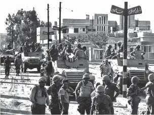  ?? ASSOCIATED PRESS FILE PHOTO ?? Israeli troops enter Gaza City on June 7, 1967, during the Six-Day War. It may well be remembered as a pyrrhic victory for Israel: a six-day war in which it vanquished several Arab armies, only to be saddled with a 50-year fight with the Palestinia­ns.