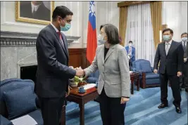  ?? TAIWAN PRESIDENTI­AL OFFICE VIA AP ?? Taiwan's President Tsai Ing-wen, center, shakes hands with California Rep. Ro Khanna during a meeting at the Presidenti­al Office in Taipei, Taiwan, on Tuesday.