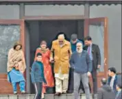  ??  ?? Farooq Abdullah (centre) meets his son and NC leader Omar Abdullah at Hari Niwas in Srinagar on Saturday.
AFP