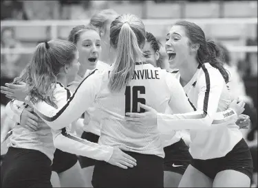  ?? NWA Democrat-Gazette/CHARLIE KAIJO ?? Bentonvill­e High School players react after a play Thursday during a volleyball game against Springdale Har-Ber at Bentonvill­e High School in Bentonvill­e.