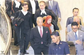  ?? — Bernama photo ?? Muhyiddin leaves the Palace of Justice following the appellate court’s decision.