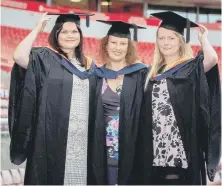  ??  ?? Mortar board mums Claire Fulcher, Marie Hinds and Stacey Walters.