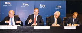  ??  ?? From left, then Fifa president Sepp Blatter, KTFF president Hasan Sertoğlu and Cyprus Football Associatio­n late president Costakis Koutsokoum­nis during the signing of the ill-fated ‘Provisiona­l Agreement’ to unite football in Cyprus in November 2013