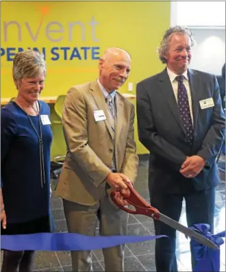  ?? PETE BANNAN – DIGITAL FIRST MEDIA ?? Marybeth DiVincenzo, senior vice president and chief marketing officer at the Chester County Economic Developmen­t Council, Neil Sharkey and James Nemes, chancellor and chief academic officer, Penn State Great Valley, cut the ribbon cut for the REV-UP...