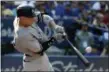  ?? JON BLACKER — THE ASSOCIATED PRESS ?? The Yankees’ Aaron Judge hits a two-run home run during the seventh inning against the Blue Jays on Sept. 24.