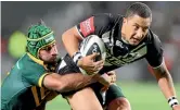  ?? PHOTO: JASON OXENHAM/ STUFF ?? Benji Marshall is tackled by Johnathan Thurston during a 2012 test between New Zealand and Australia at Eden Park.