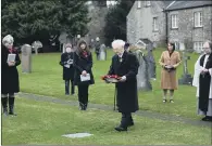  ??  ?? ANNIVERSAR­Y: A wreath is laid at the grave of Brigadier Wyatt by 100- year- old Bill Packham, who served in the RAF, inset below.