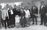  ?? Westside Eagle Observer/SUSAN HOLLAND ?? The 10 suspects in the “Who Dun It?” murder mystery game at the Gravette Public Library gala Saturday evening, Nov. 3, are joined by Will Trentham, master of ceremonies for the evening, and David Keck, who played the role of Detective Clarence O’Dell.