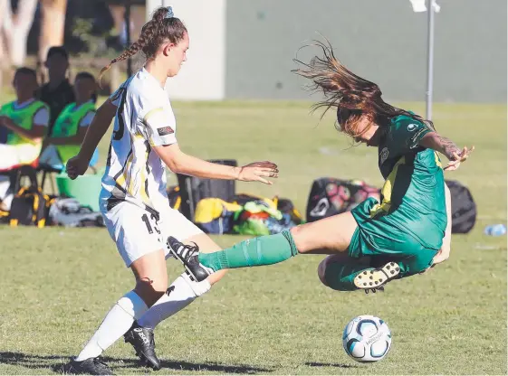  ?? Picture: RICHARD GOSLING ?? Mudgeeraba’s Jemima Lockley battles Mitchelton’s Chantelle Nohokau, who broke her wrist in this tackle.