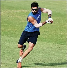  ??  ?? India’s Virat Kohli takes a catch during a training session at the Punjab Cricket Stadium Associatio­n Stadium in Mohali on March 26, ahead of the World T20
cricket tournament match against Australia on March 27. (AFP)