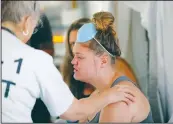  ?? AP/GERALD HERBERT ?? Aleeah Racette receives medical treatment Thursday inside the Florida 5 Disaster Medical Assistance Team tent outside the Bay Medical Sacred Heart hospital in the aftermath of Hurricane Michael in Mexico Beach, Fla.