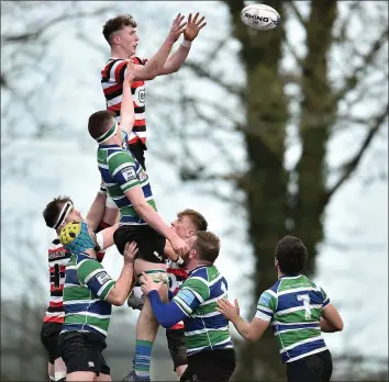  ??  ?? Nick Doyle rising highest to win line-out possession in last year’s Towns Cup semi-final derby with Gorey.
