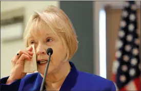  ?? NWA Democrat-Gazette/DAVID GOTTSCHALK ?? Toni Boone, John T. Hussey’s widow, wipes away a tear Thursday while speaking during the Springdale Officer John T. Hussey Memorial Highway dedication at Springdale’s City Council chambers. Hussey was killed in the line of police duty in 1975. The new U.S. 612, the northern bypass of Springdale, was dedicated in honor of Hussey.