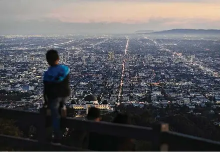  ?? Jae C. Hong/Associated Press ?? Los Angeles sprawls below Griffith Park. The United Nations estimated the global population hit 8 billion on Tuesday.