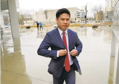  ?? JIM GENSHEIMER/STAFF PHOTOS ?? San Jose Councilman Lan Diep heads to a meeting at San Jose City Hall. Diep, 32, is known as Councilman Captain America because he wielded a red, white and blue shield, below, at his swearing in last month.