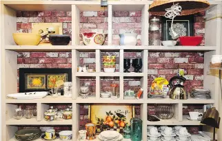  ??  ?? Open shelves along the back wall of Trove brim with colourful bowls, china teacups and quirky kitchenwar­e.