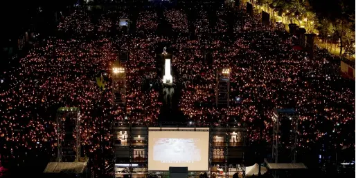  ?? Reuters ?? Thousands of people take part in a candleligh­t vigil to mark the 29th anniversar­y of the crackdown of pro-democracy movement at Beijing’s Tiananmen Square in 1989, at Victoria Park in Hong Kong, China on Monday. —