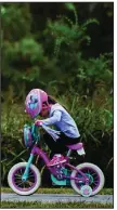  ?? (Democrat-Gazette file photo/ Stephen Swofford) ?? Haley Relano, 4, rides her bike with her family in Two Rivers Park in October.