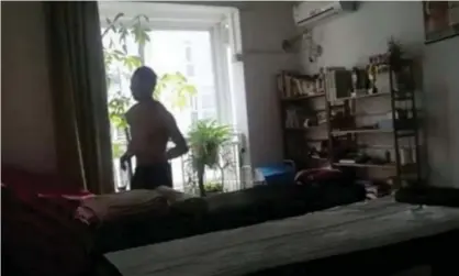  ??  ?? Pan Shancu, from Hangzhou, exercising in his flat. Photograph: Weibo