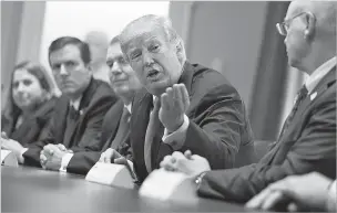  ?? EVAN VUCCI/THE ASSOCIATED PRESS ?? President Donald Trump speaks Thursday during a meeting with steel and aluminum executives at the White House. White House aides spent Wednesday night and Thursday morning scrambling to steer the president away from an announceme­nt on an unfinished policy on aluminum and steel tariffs, but they were unsuccessf­ul.