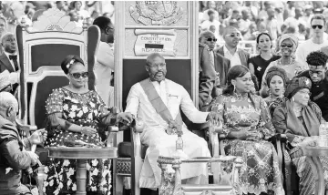  ??  ?? Weah (centre), the country’s former President Ellen Johnson Sirleaf (right), the country’s new Vice-President Jewel Taylor (left) and Weah’s wife Clar Weah attend Weah’s swearing-in ceremony in Monrovia. — AFP photo