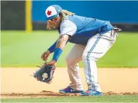  ?? NATHAN DENETTE THE CANADIAN PRESS ?? Top Jays prospect Vladimir Guerrero Jr. continues to work on his agility and glovework at third base in Dunedin, Fla.