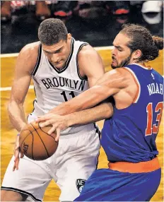  ?? Anthony J. Causi ?? BATTLE OF THE BIGS: Brook Lopez battles with Joakim Noah during the Nets’ preseason game against the Knicks on Thursday at Barclays Center.