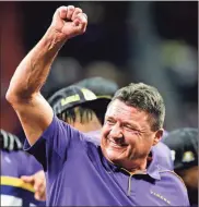  ?? Chattanoog­a Times Free Press via AP - C.B. Schmelter, file ?? Three days after his quarterbac­k, Joe Burrow, cruised to the Heisman Trophy, LSU’S Ed Orgeron, above, was named the AP Coach of the Year.