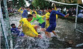  ?? Photograph: Ben Birchall/PA ?? A goalmouth scramble during the traditiona­l match in the Cotswolds village of Bourtonon-the-Water.