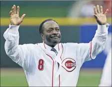  ?? AL BEHRMAN — THE ASSOCIATED PRESS ?? Cincinnati Reds Hall of Fame second baseman Joe
Morgan acknowledg­es the crowd after throwing out a ceremonial first pitch prior to the Reds’ game against the St. Louis Cardinals in Cincinnati on April 7, 2010. A family spokesman said the longtime Red and former Phillie died at his home Sunday, Oct. 11, 2020, in Danville. Morgan was 77.