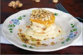  ?? PHOTO BY EMILY RYAN ?? This orange napoleon dessert features fresh fruit, Greek yogurt, pistachios and honey.