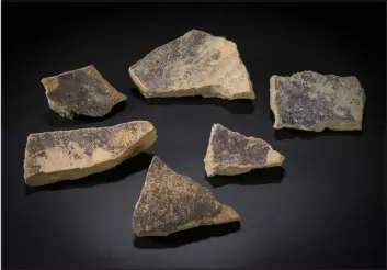  ?? MOSHE CAINE, VIA BIBLE LANDS MUSEUM JERUSALEM VIA THE NEW YORK TIMES ?? Pieces of an ancient vat of purple dye from Tel Shiqmona. Archaeolog­ists in Israel have revealed a production site for one of history’s most luxurious, and smelliest, colorants.