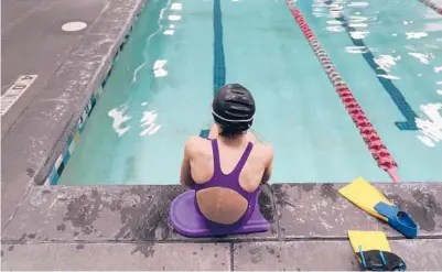  ?? RICK BOWMER/AP ?? A proposed ban on transgende­r athletes playing girls school sports in Utah would affect transgende­r girls like this 12-year-old swimmer. She cried when she heard about the legislativ­e proposal, which would separate her from her friends.