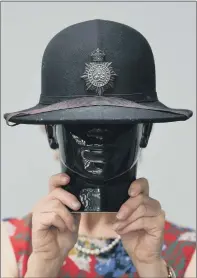  ?? PICTURES: JONATHAN GAWTHORPE ?? Clockwise from top, an officer’s helmet plate of Grantham Borough Police; a Lincolnshi­re Constabula­ry woman’s helmet; a Second World War army officer’s compendium; and militaria specialist Oonagh Drage with a 19th century powder horn.