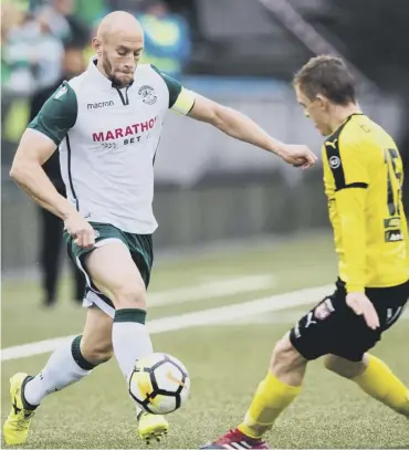  ??  ?? 0 David Gray takes on Runavik’s Paetur Hentze during Hibs’ victory in the Faroe Islands last night.