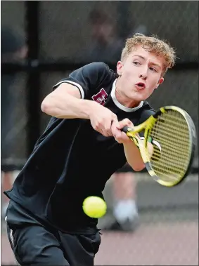  ?? SARAH GORDON/THE DAY ?? In this May 22, 2019, file photo, East Lyme’s Finn Power returns a ball during the ECC boys’ tennis tournament singles final at East Lyme High School.