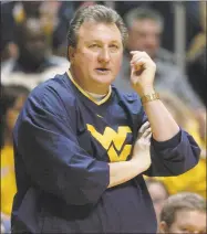  ?? Jeff Gentner / Associated Press ?? West Virginia men’s basketball coach Bob Huggins will voluntaril­y take a 10% salary reduction starting July 1.