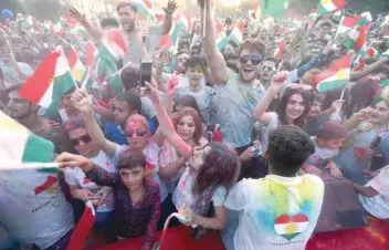  ?? — AFP ?? Iraqi Kurds during an event to urge people to vote in the upcoming independen­ce referendum in Arbil, the capital of the autonomous Kurdish region of northern Iraq, on Friday.