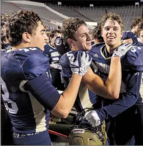  ?? Arkansas Democrat-Gazette file photo ?? ABOVE Pulaski Academy’s (from left) Grant Pignio, John David White and Blake Titus celebrate with teammates after their 37-36 victory over Little Rock McClellan in the Class 5A state championsh­ip Dec. 2 at War Memorial Stadium. White and Titus are among the key returners this season as the Bruins go for their fifth consecutiv­e state title. LEFT Pulaski Academy’s Hayden Cobb intercepts a pass intended for McClellan’s Jaylin Cunningham in last year’s title game.