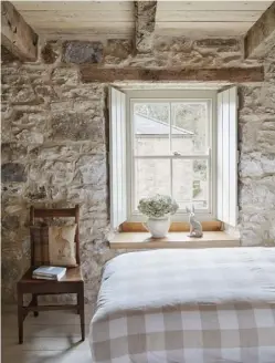  ??  ?? OPPOSITE Pale, calming tones establish a restful mood in the guest bedroom, where simple checks create a homespun feel
THIS PAGE, CLOCKWISE
FROM ABOVE RIGHT Upstairs, the combinatio­n of exposed brick and timber is softened by elegant painted...