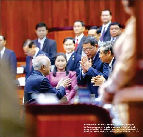  ?? PHA LINA ?? Prince Norodom Ranariddh (left), head of the royalist Funcinpec party, greets members of the National Assembly after his party entered parliament yesterday thanks to a controvers­ial redistribu­tion of seats.