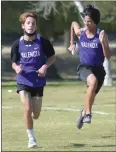  ?? Dan Watson/The Signal ?? (Left) West Ranch High School junior Hayden Washington finishes first for the girls in a race against Golden Valley High School at Central Park in Saugus on Saturday (Right) Valencia runner Marcus Espinoza, right, overtakes teammate Tomi Lessis for second place at the finish of the 3-mile freshman-sophomore cross-country race against Hart